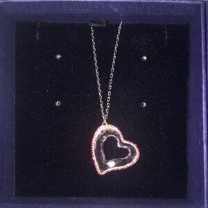 pink heart neckace on a chain